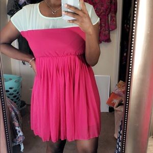 A sea green and hot pink pleated dress.